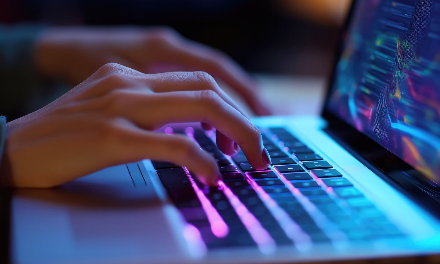 hands typing on a laptop